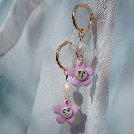 Purple Flower Face on Pearl Huggie Earrings