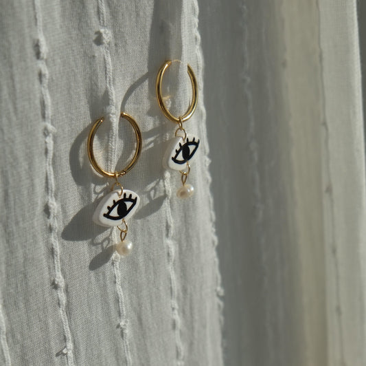 The Crying Pearl Eye Huggie Hoops Earrings